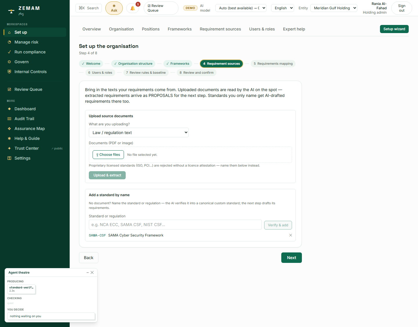 Naming "SAMA Cyber Security Framework" and clicking Verify. The small panel in the bottom-left corner is the AI actually running — not a mock-up of one.